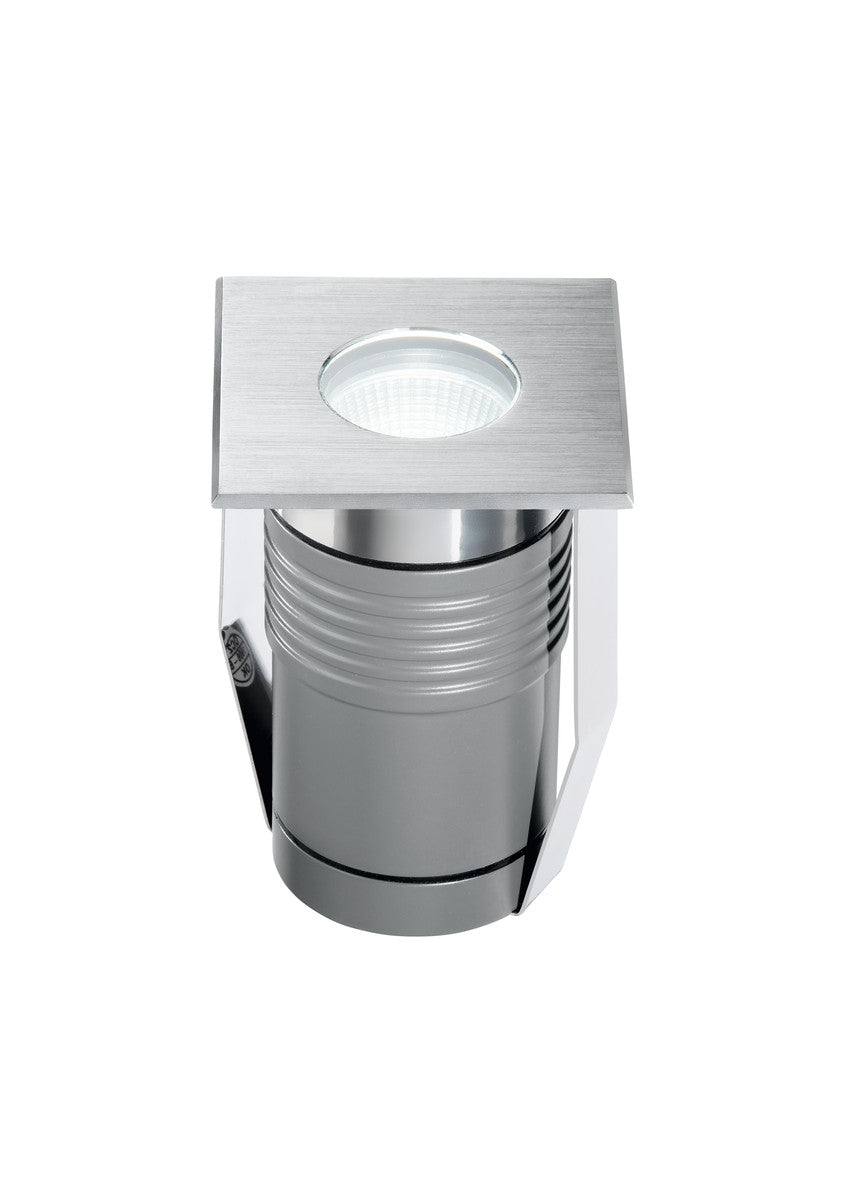 Vue rapprochée du luminaire montrant la platine carrée et le corps cylindrique