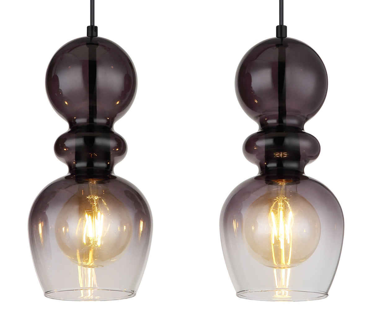 Détail rapproché de deux globes en verre fumé et ampoule filament allumée