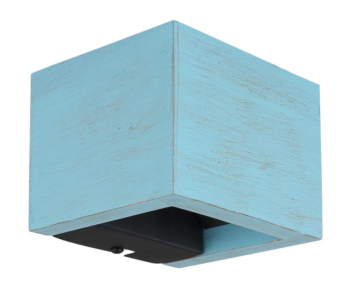 Autre angle de vue du bloc carré bleu clair aux finitions usées, socle noir