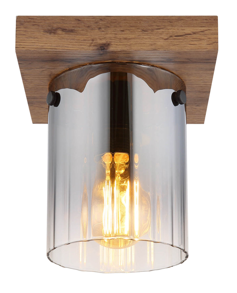 Détail de la finition : vis apparentes, verre cylindrique et filament ambré allumé