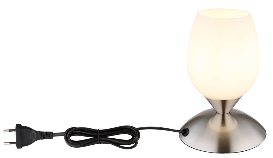 Vue du cordon d'alimentation noir avec fiche, enroulé près de la lampe.