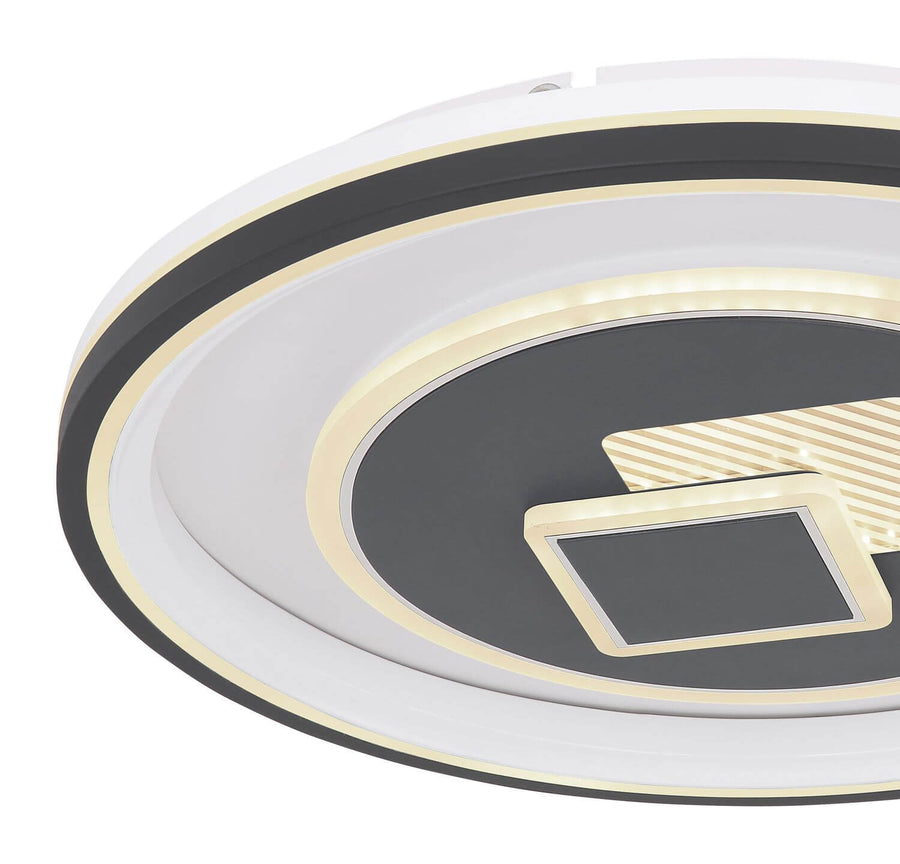 Détail de la finition : cercles dorés et motif géométrique en gros plan.