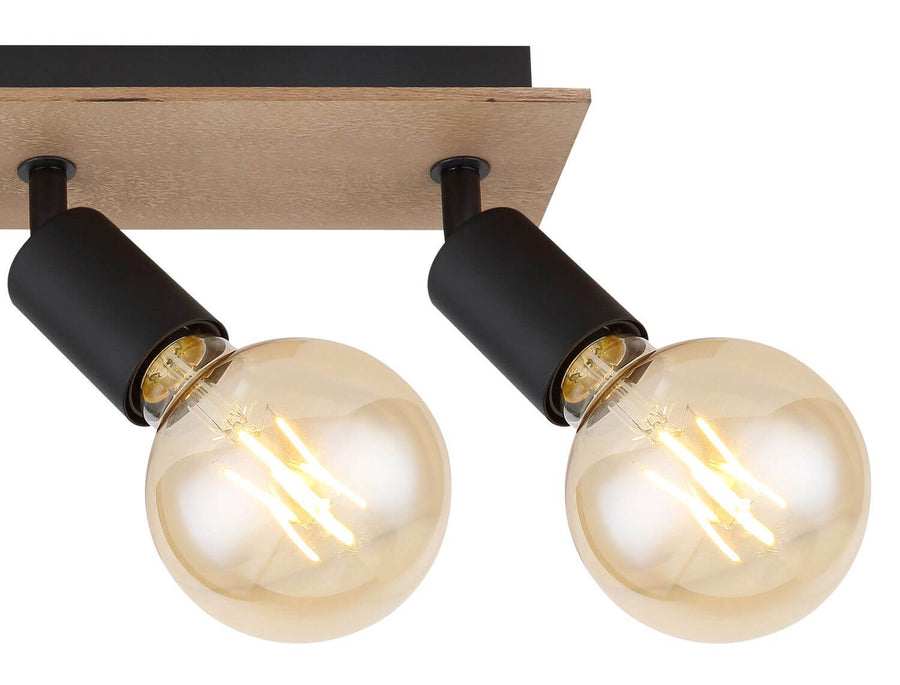 Détail des douilles cylindriques noires et des ampoules à filament ambrées