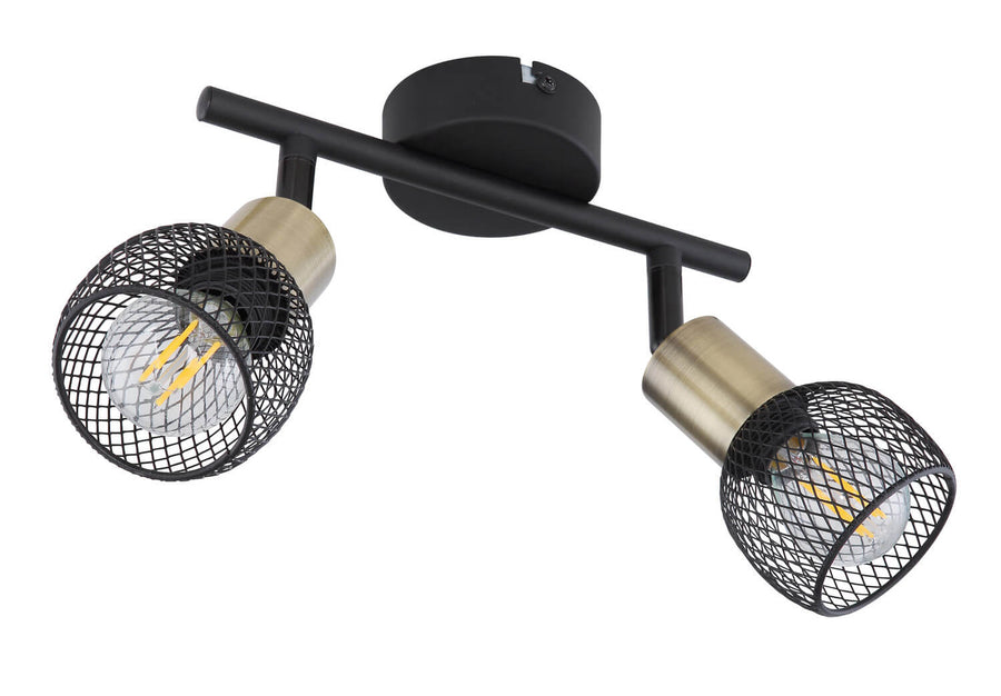 Détail du spot orientable montrant la finition noire mate et le cylindre en laiton brossé