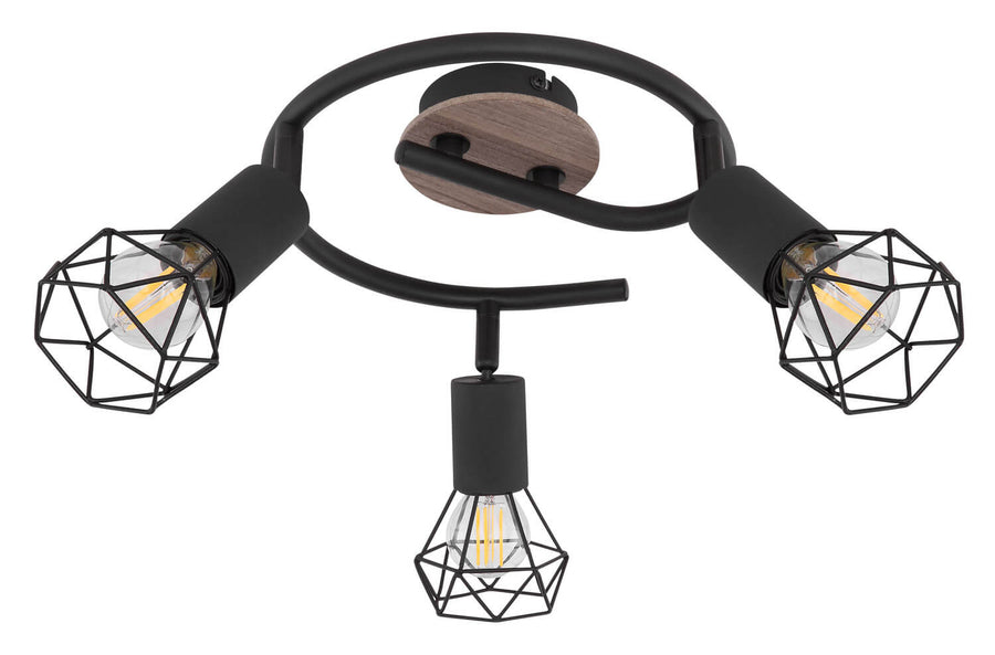 Luminaire présenté de biais, montrant les trois spots orientables allumés