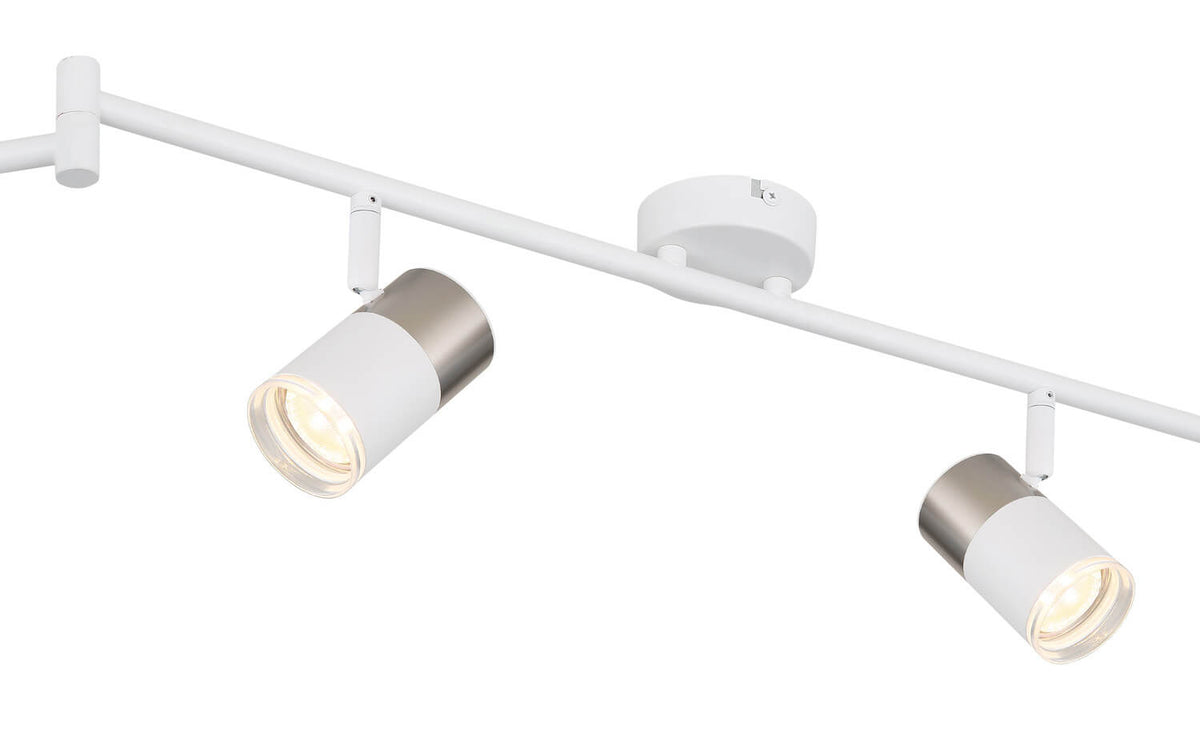 Détail rapproché d'un projecteur : corps blanc mat et capot gris métallisé
