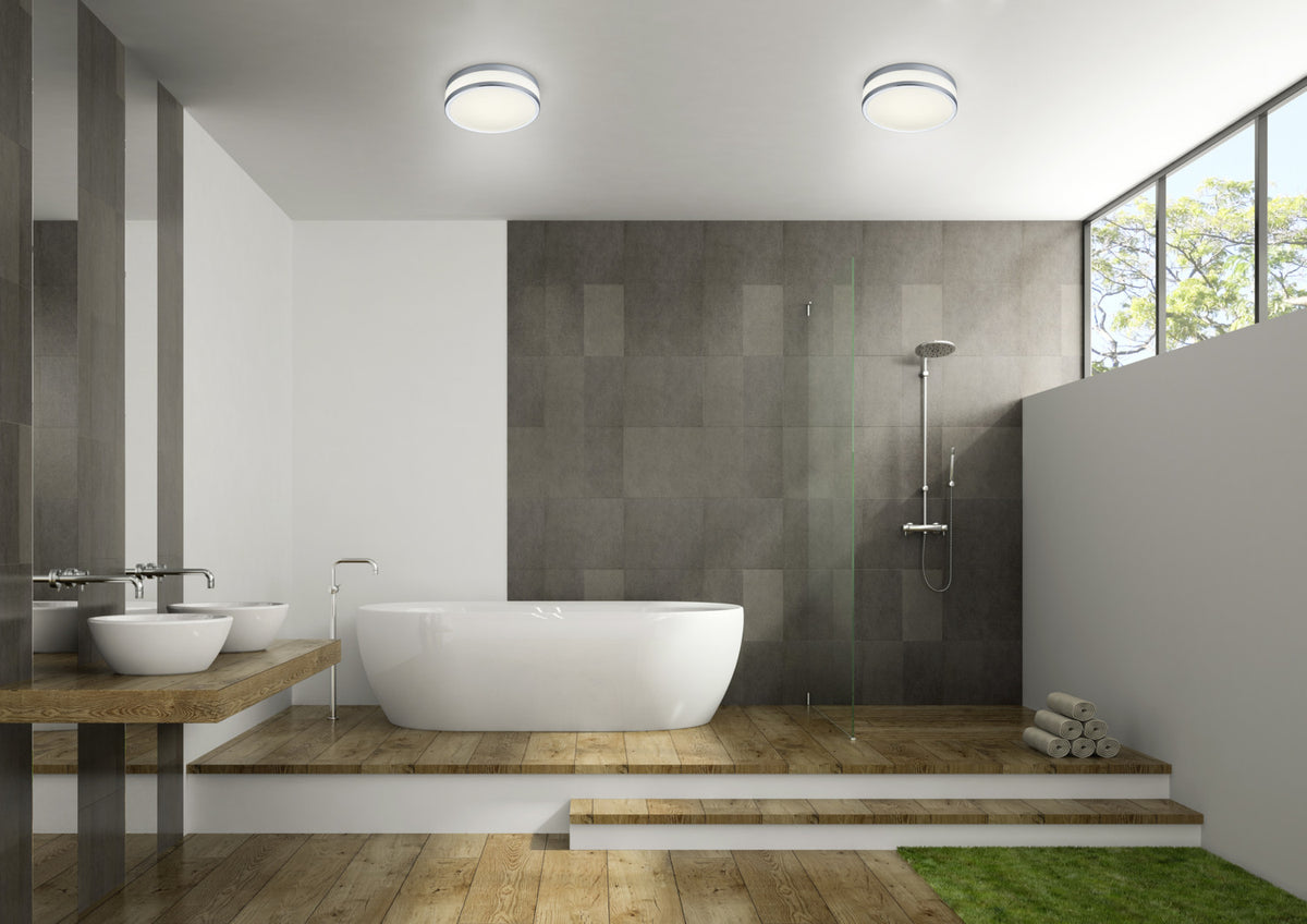 Mise en ambiance d'une salle de bain moderne avec deux plafonniers ronds allumés