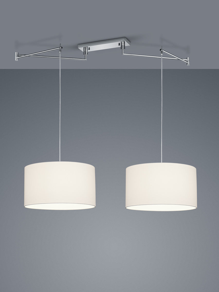 Vue rapprochée des deux cylindres blancs et du support chromé fixé au plafond.