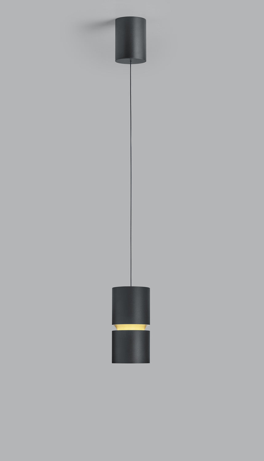 Détail du cylindre noir suspendu avec fente lumineuse jaune et finition mate.