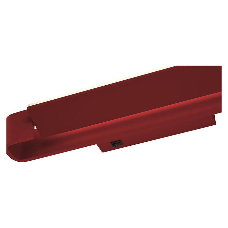 Détail du dessous avec interrupteur noir et cache blanc du luminaire rouge