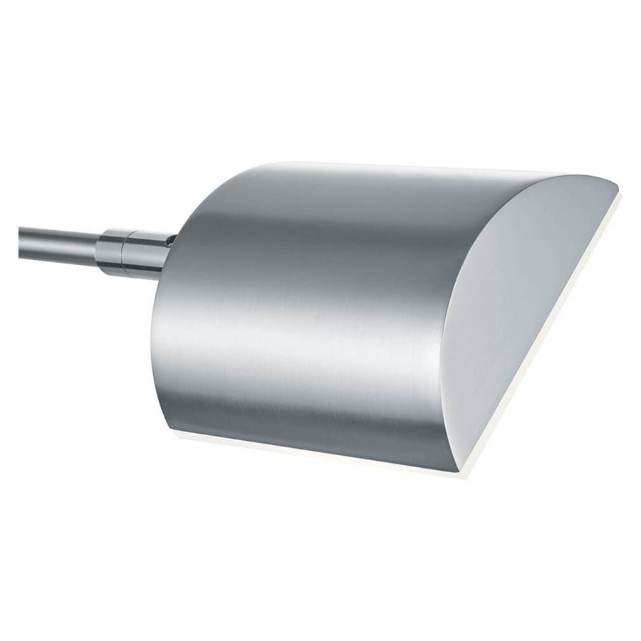 Gros plan sur le boîtier métallique incurvé et le diffuseur opaque de la lampe.