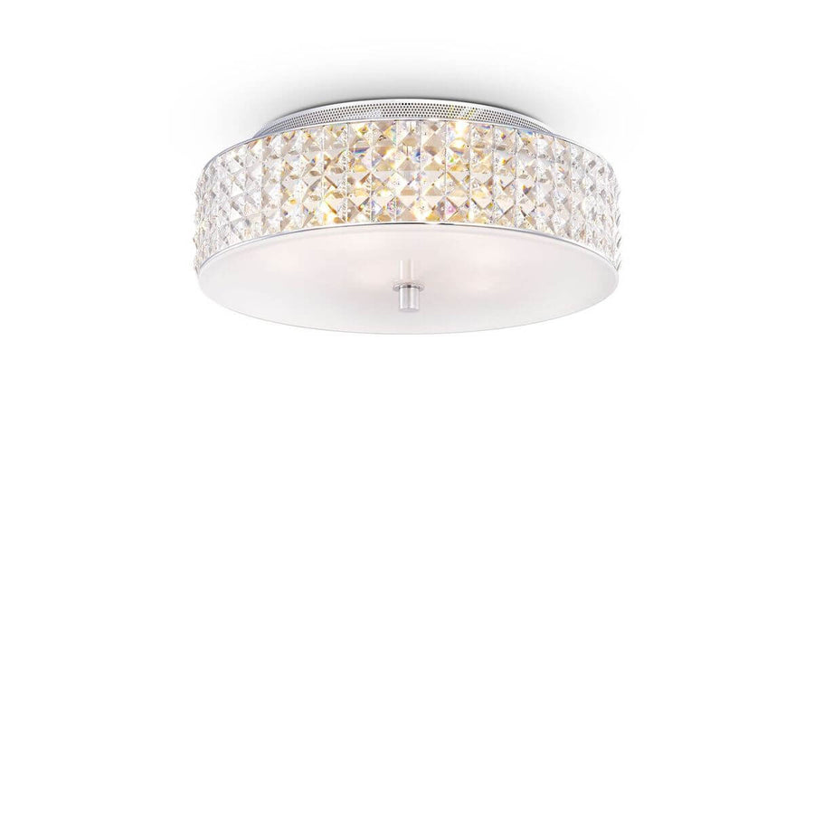 Plafonnier rond de face sur fond blanc, bordure en cristal taillé et diffuseur opale.