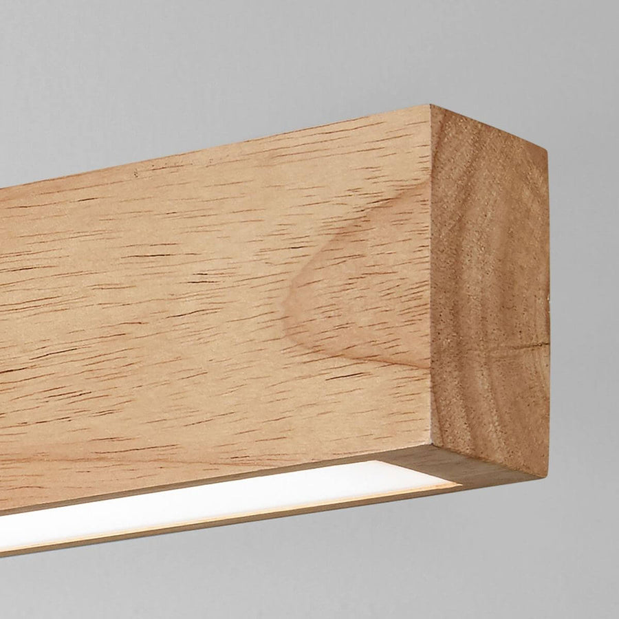 Détail de la finition du bois et du bandeau lumineux LED sous la poutre