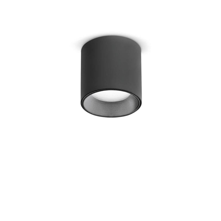 Vue de face du plafonnier cylindrique noir mat avec diffuseur en verre blanc