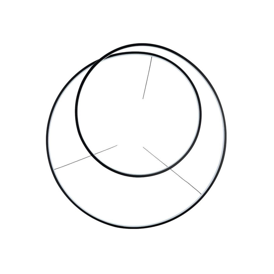Vue de dessous montrant les deux cercles noirs entrelacés du luminaire