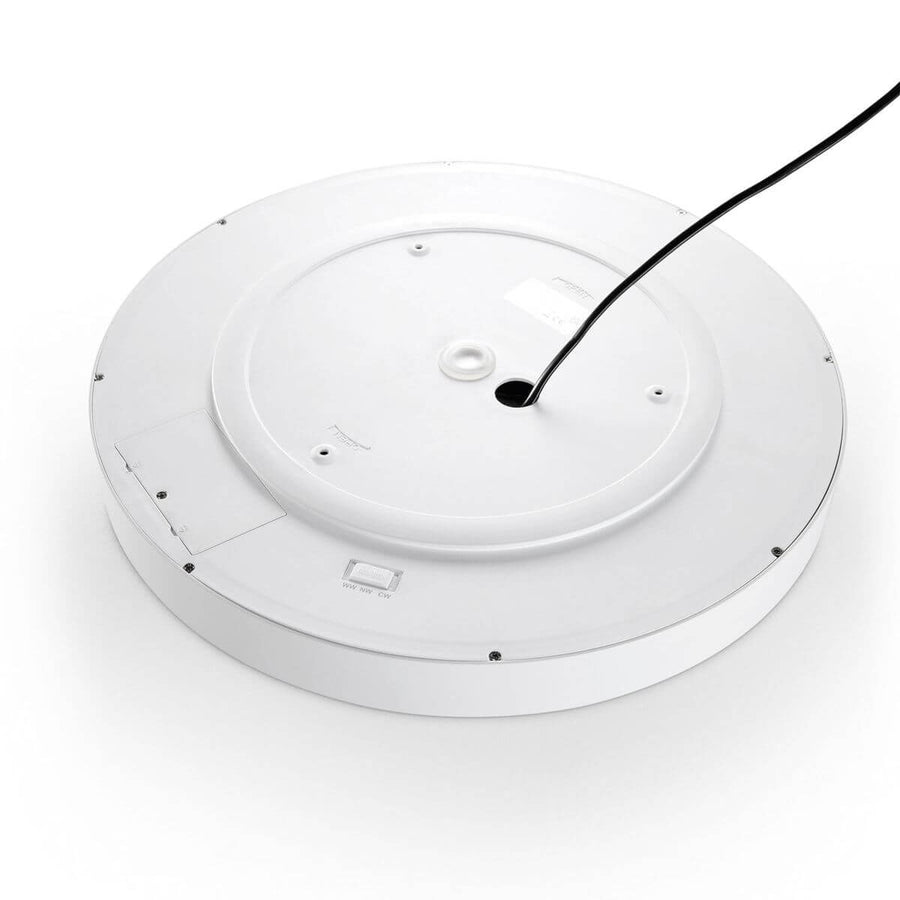 Vue arrière du luminaire, boîtier blanc, câble noir et trappe de réglage