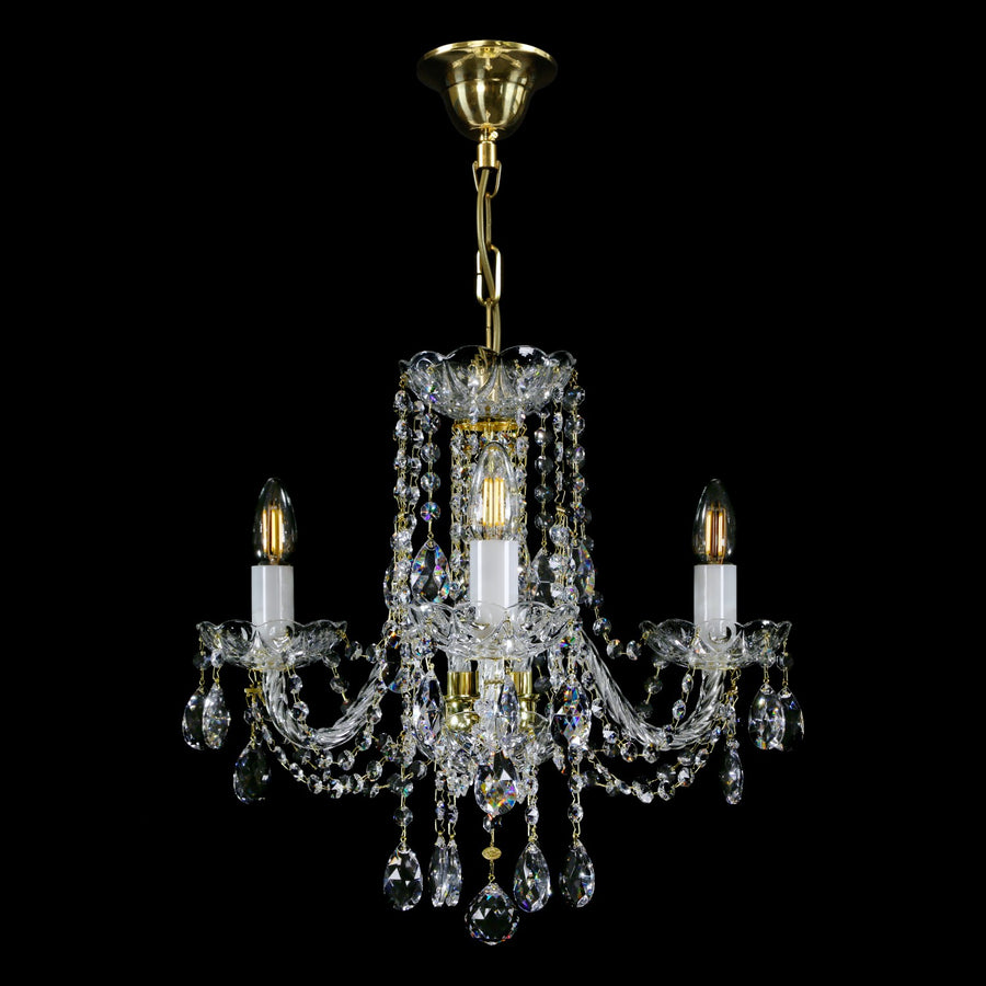 Lustre vu de face avec finition dorée, support plafond et maillons de chaîne apparents