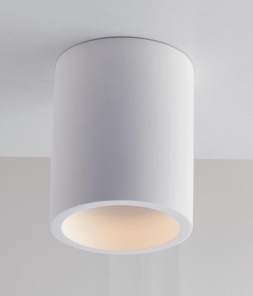 Vue de dessous montrant la source lumineuse chaude et le diffuseur rond blanc