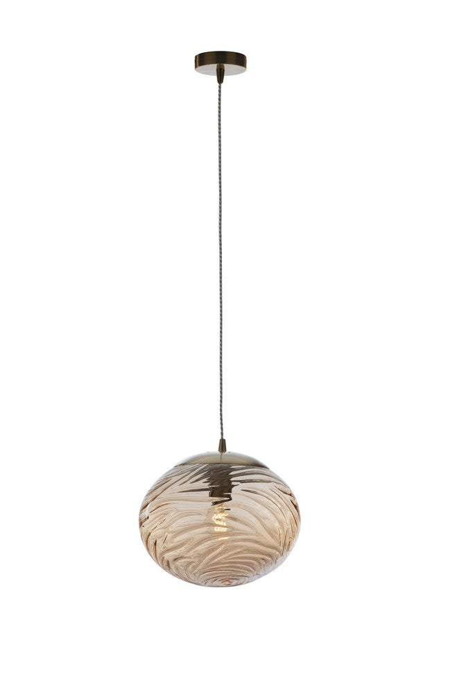 Vue rapprochée de l'abat-jour boule en verre aux motifs tourbillonnants