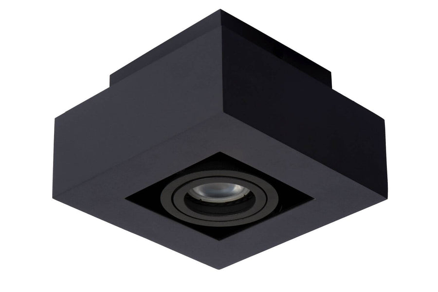 Produit éteint vu de dessous, boîtier cubique noir et lentille de verre