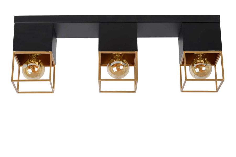 Présentation frontale du luminaire, trois cages dorées et ampoules vintage allumées.