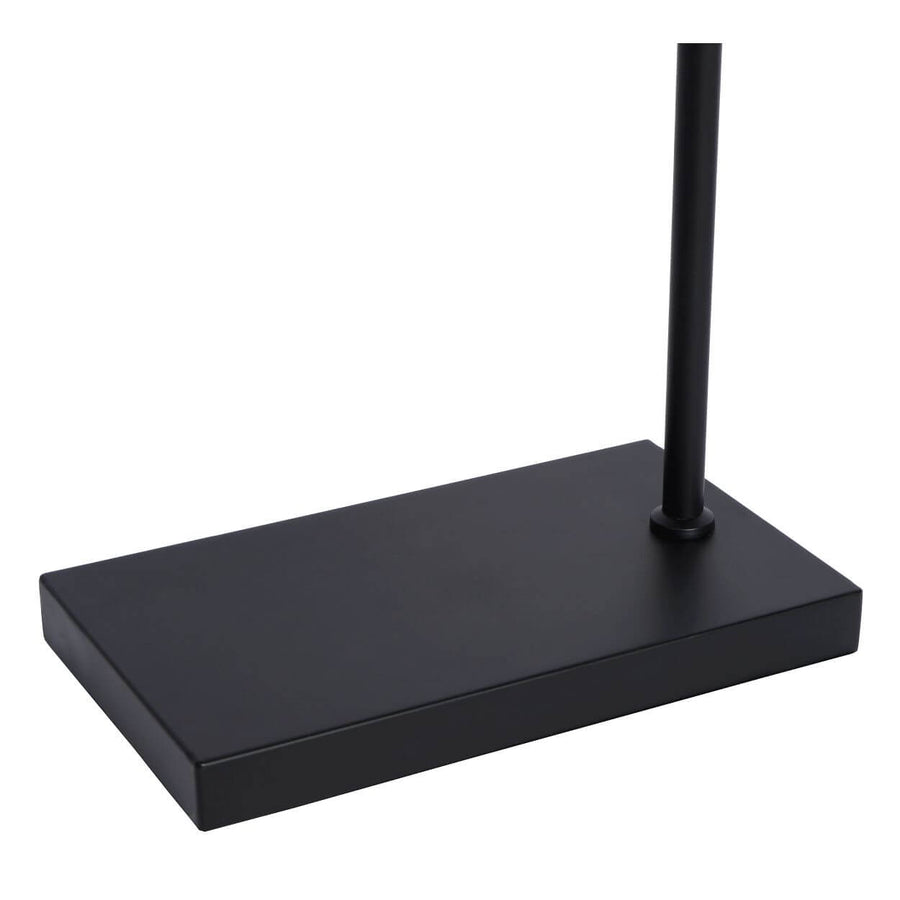 Détail de la base rectangulaire noire et du pied vertical du lampadaire.