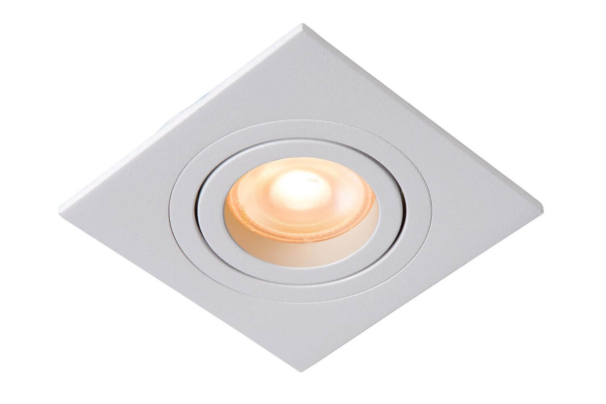 Vue de face du spot carré blanc allumé, anneau intérieur orientable et verre bombé
