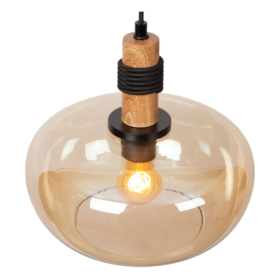 Détail du cylindre en bois, du cordon noir enroulé et du verre ambré