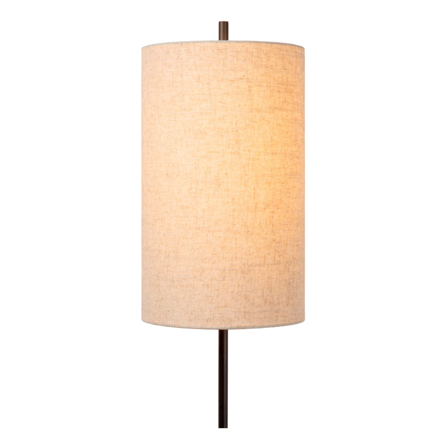Gros plan sur l'abat-jour cylindrique en lin, texture et coutures visibles.