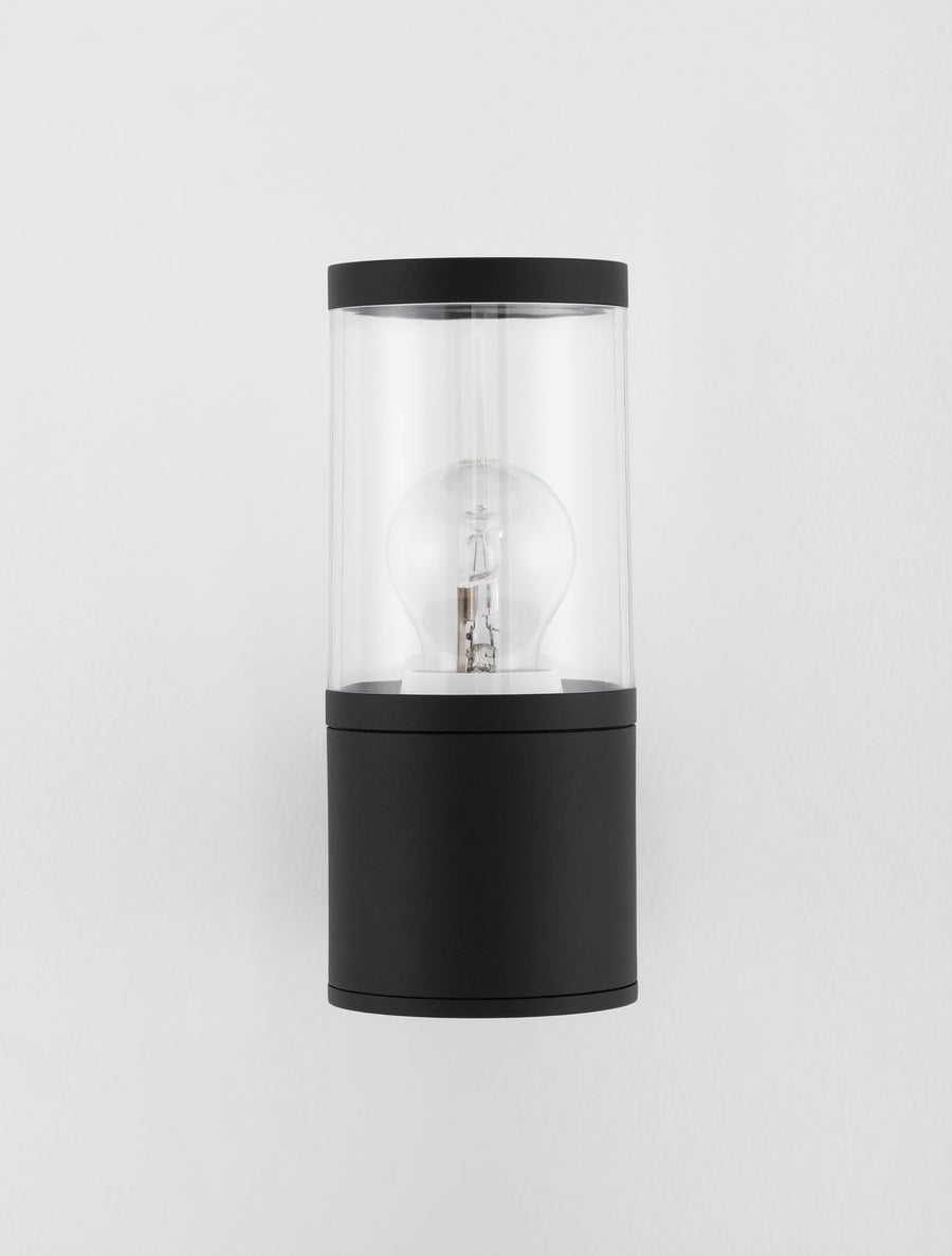 Produit seul sur fond gris clair, montrant le cylindre noir et le verre.