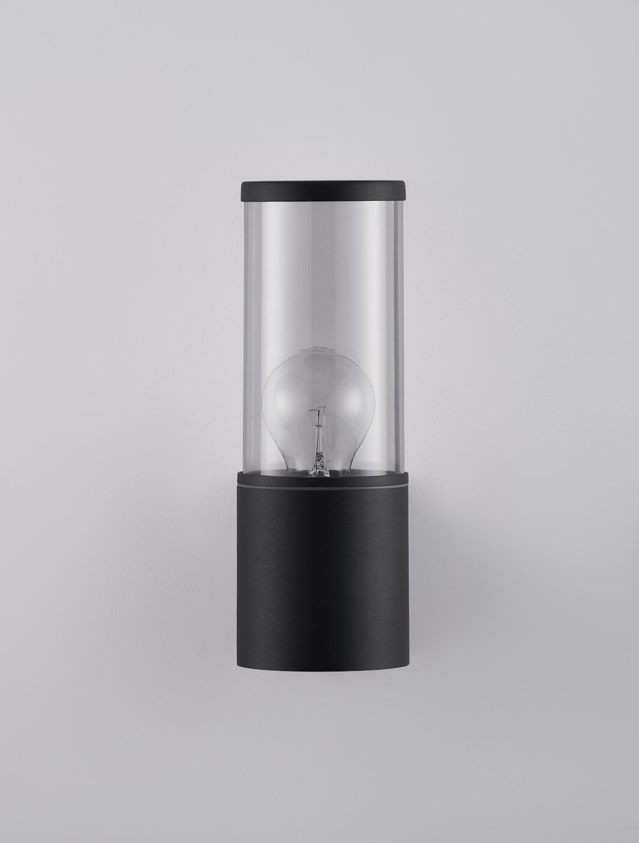 Vue de face sur fond gris clair, ampoule globe visible dans le verre