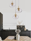 Suspension Maeve 3 lumières dorée, verre