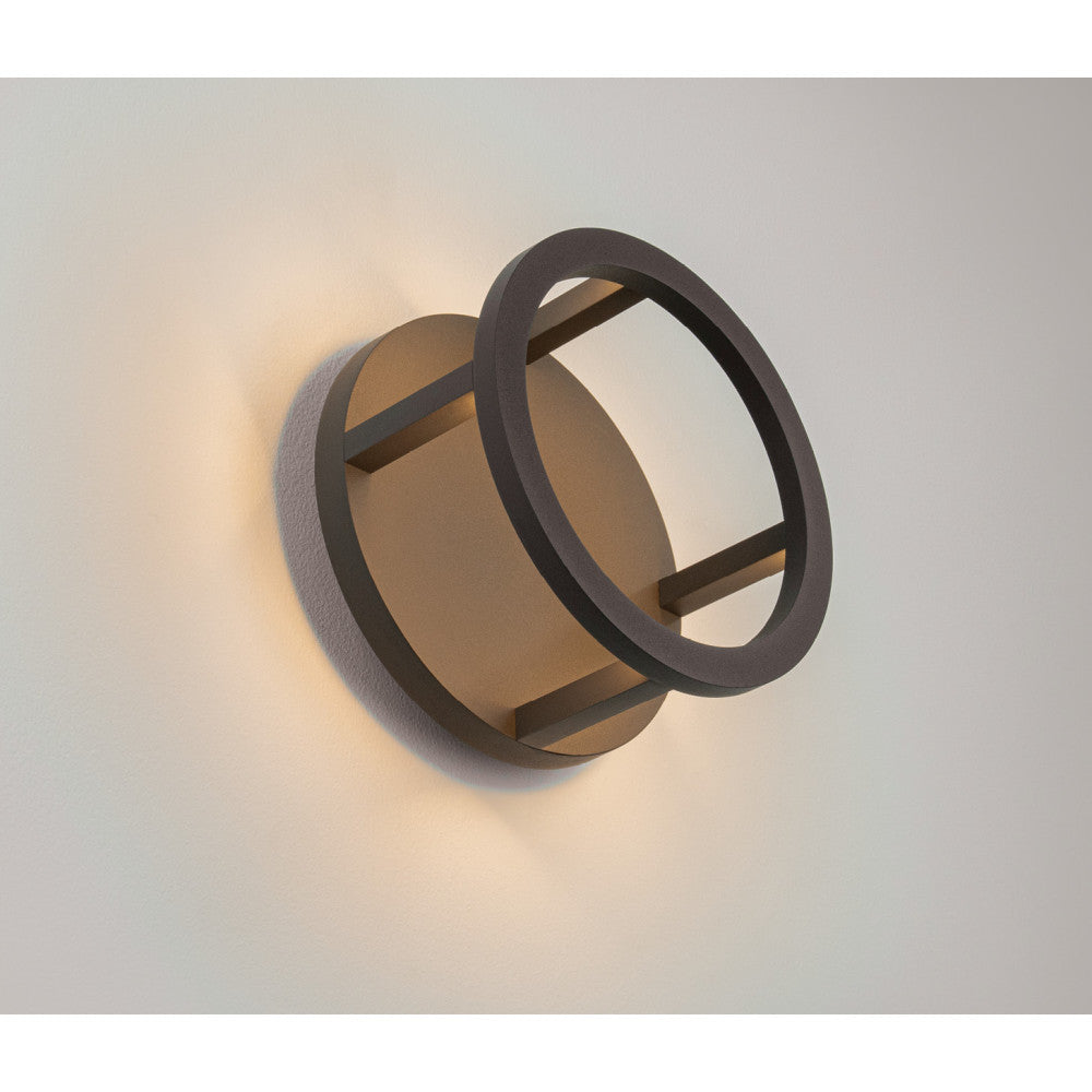 Applique ronde fixée au mur, halo lumineux chaud diffusé en haut et en bas