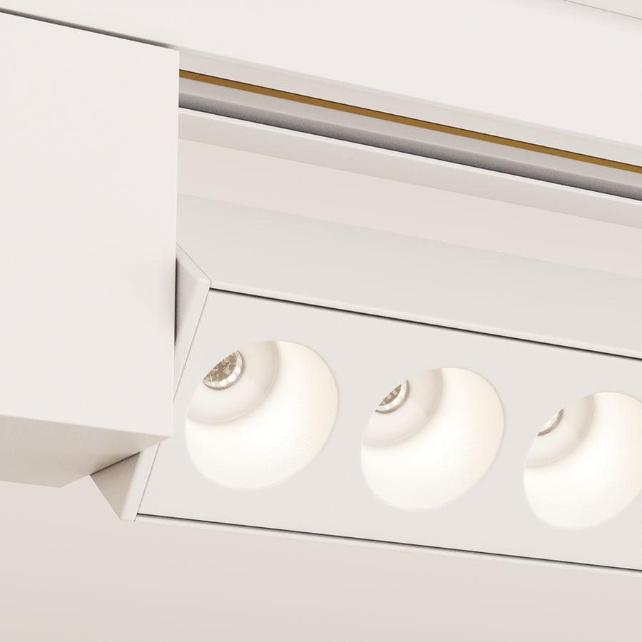 Détail rapproché des modules optiques blancs et de leur anneau lumineux allumé.