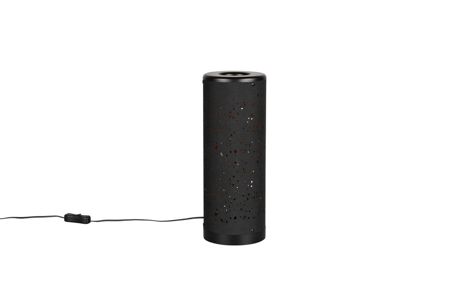 Lampe éteinte montrant la tôle noire et les perforations du motif