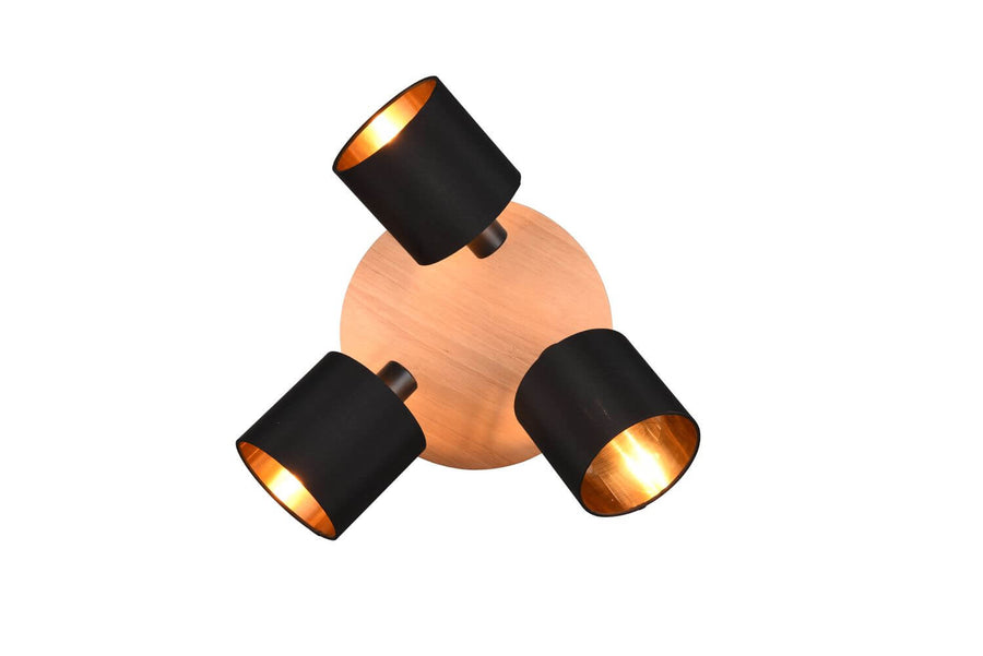 Vue de dessus du luminaire, platine en bois clair et trois projecteurs noirs répartis en cercle