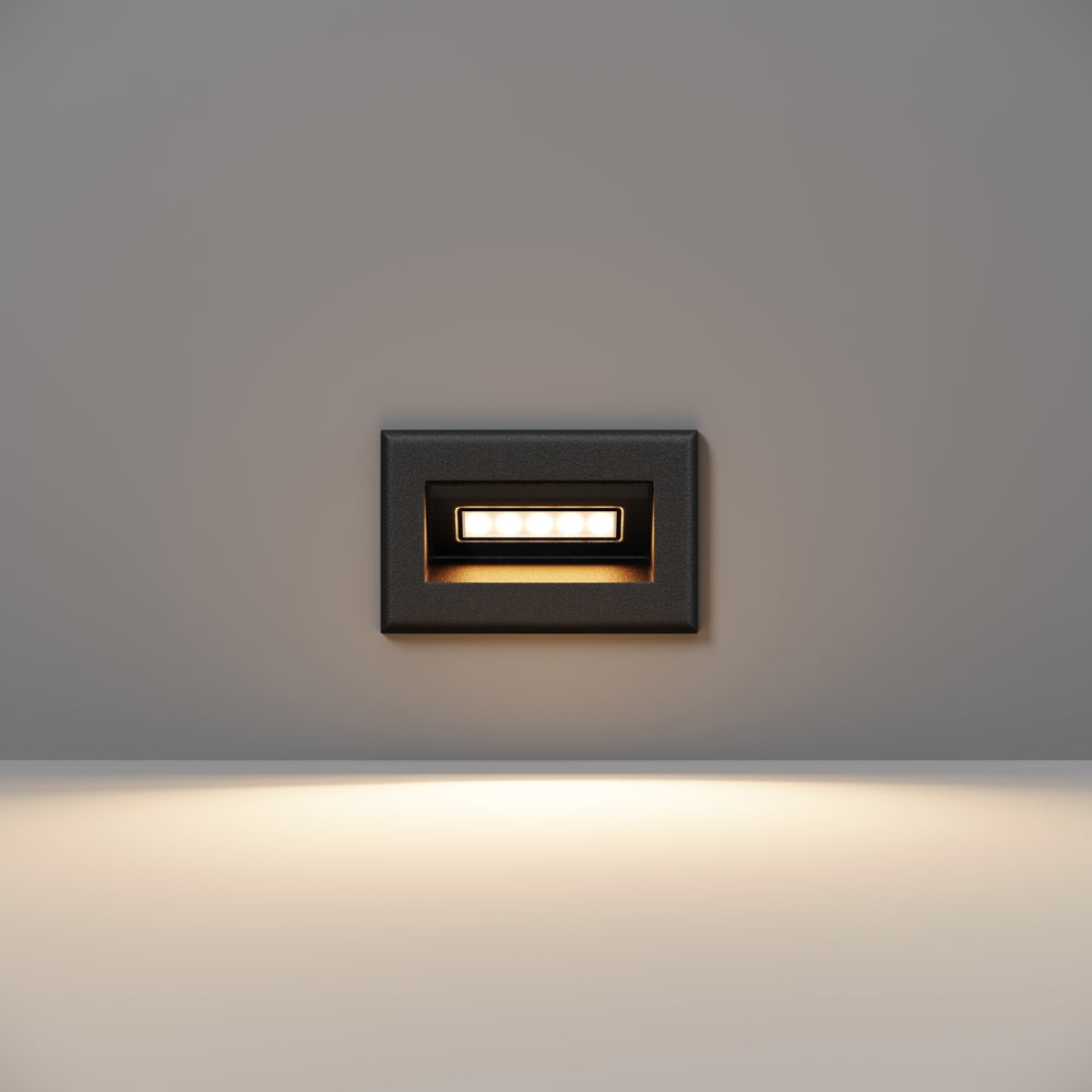 Modèle noir de format carré compact, petite barre LED allumée en façade