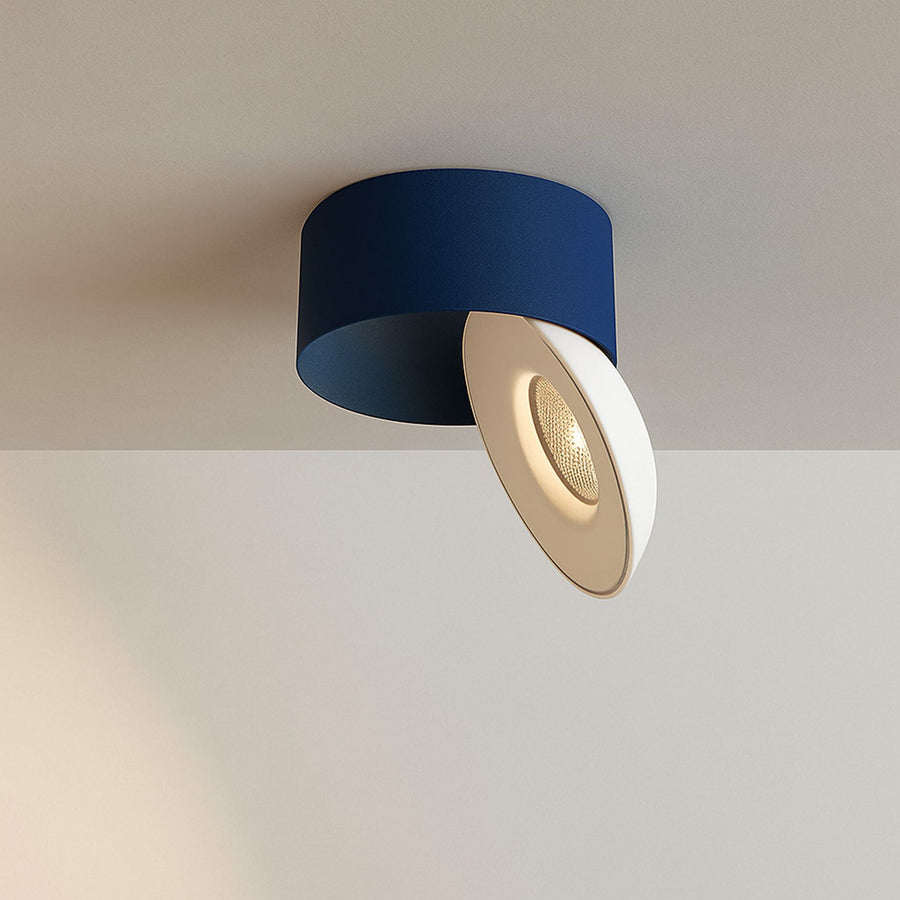 Version bleu nuit du spot, corps cylindrique et diffuseur blanc orientable en gros plan