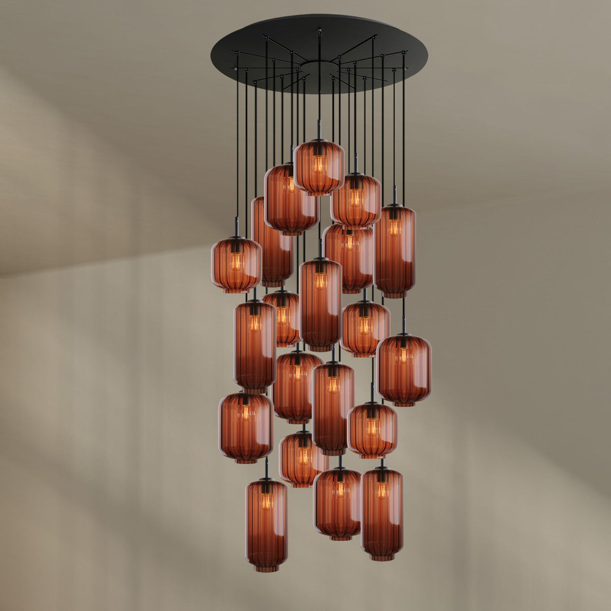 Produit seul sur fond beige, rosace noire et vingt verres ambrés de tailles variées