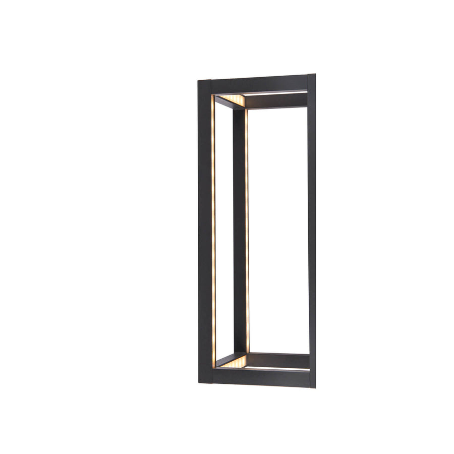 Vue de profil éclairée, cadre anthracite et diffuseur lumineux chaud.