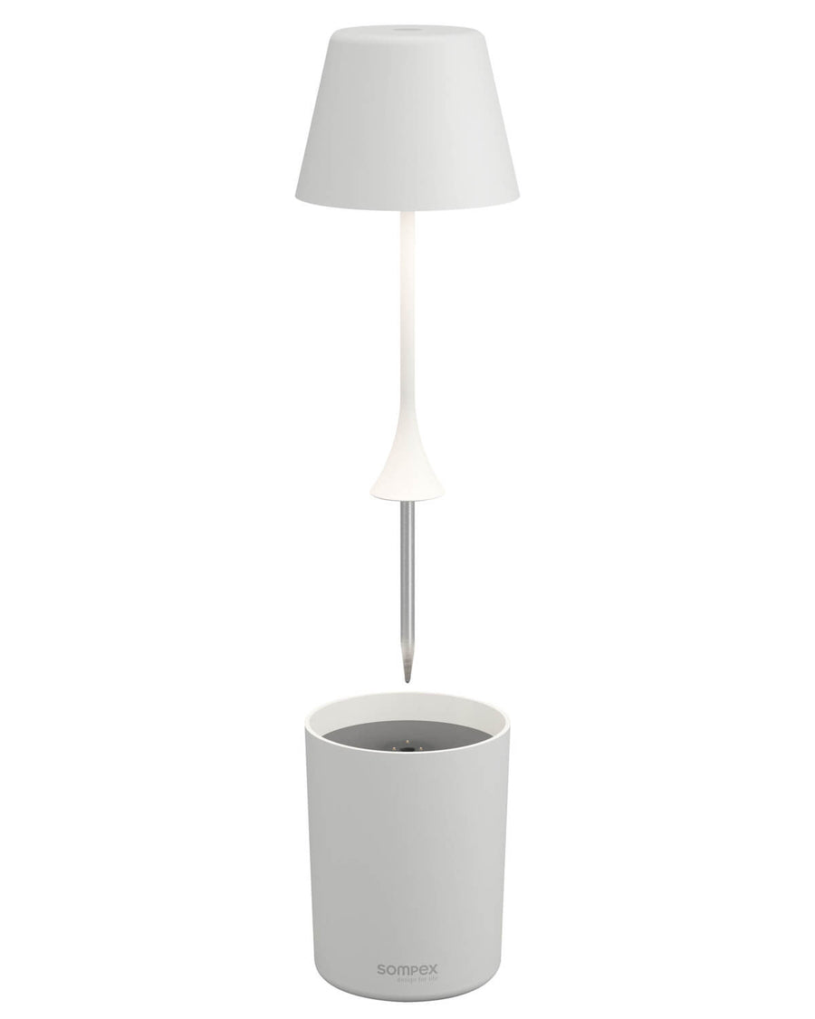 Vue éclatée montrant l'abat-jour, la tige à pointe et le socle cylindrique.