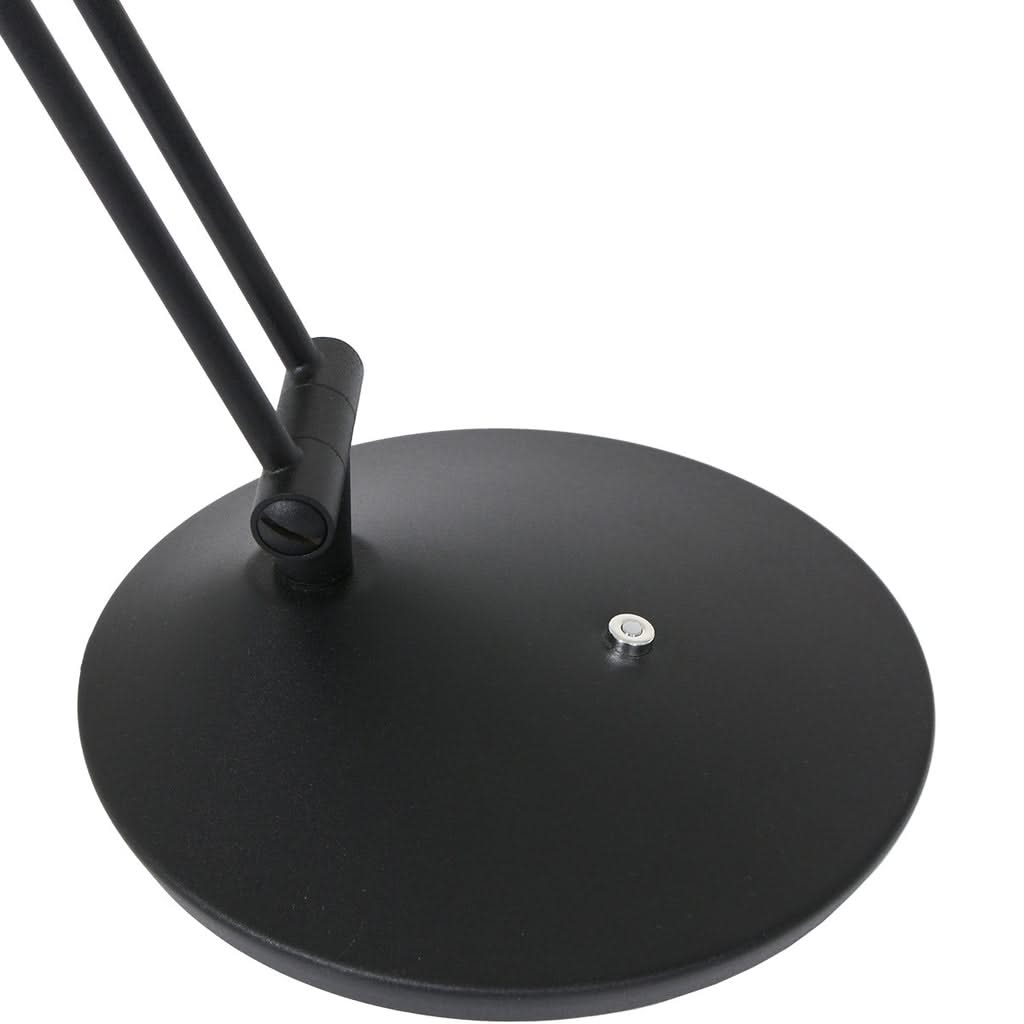 Détail de la base ronde noire et de l'articulation inférieure avec vis de fixation.