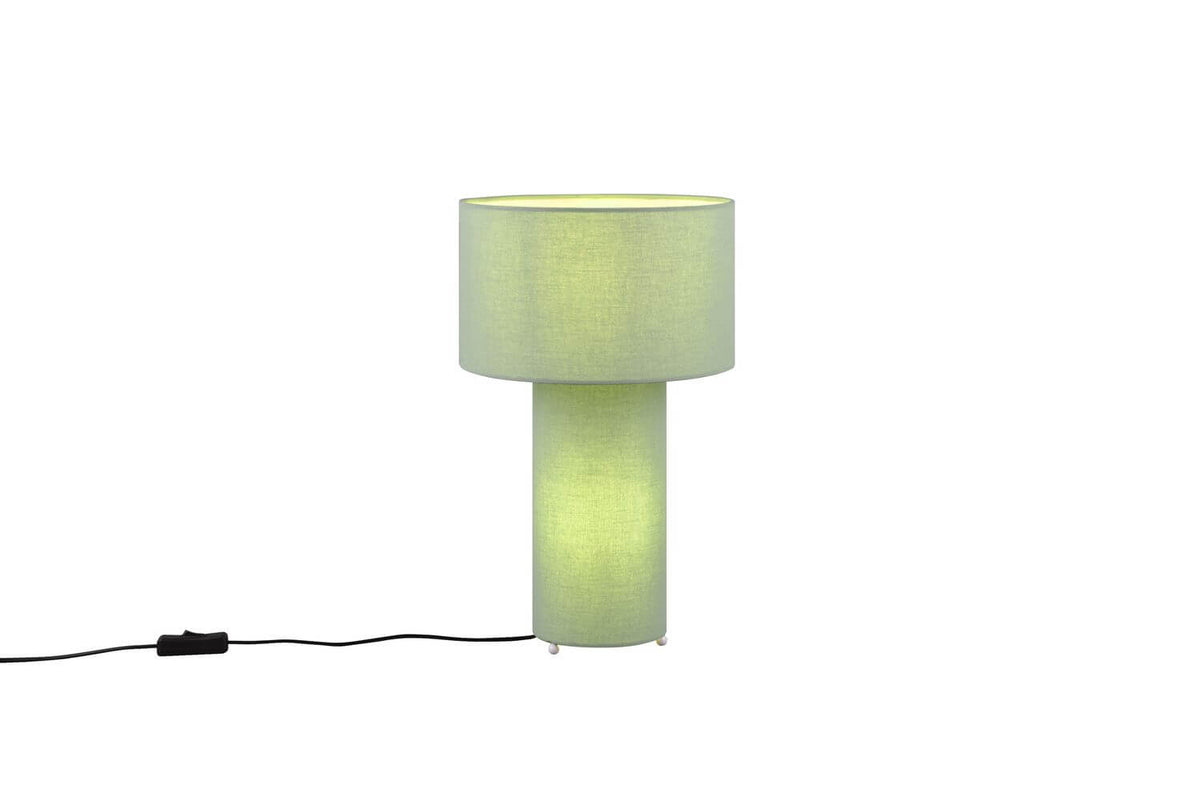 Lampe à poser verte sur fond blanc, abat-jour et pied cylindriques en tissu
