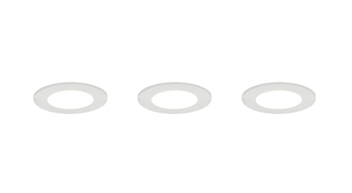 Trois spots éteints vus de face, diffuseur central et collerette fine